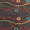 Black, yellow, red, and green taffeta wave and circle print tablecloth and runner.