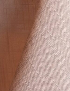 Blush pink textured dinner napkin.