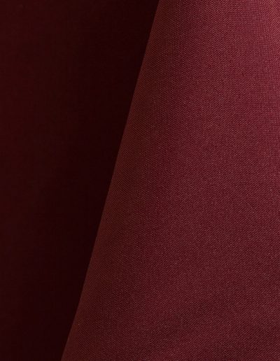 Burgundy polyester tablecloth, runner, sash, and dinner napkin.