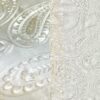 Ivory paisley print tablecloth.