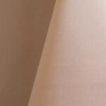 Pale peach polyester tablecloth, runner, sash, and dinner napkin.