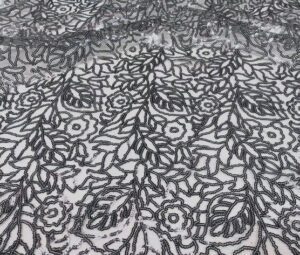 Pewter sequin leaf print sheer tablecloth and runner.