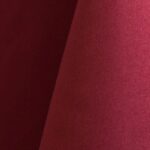 Ruby red polyester tablecloth, runner, sash, and dinner napkin.