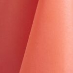 Salmon pink polyester tablecloth, runner, sash, and dinner napkin.
