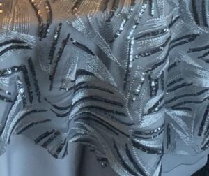 Silver and charcoal grey sequin abstract sheer tablecloth.