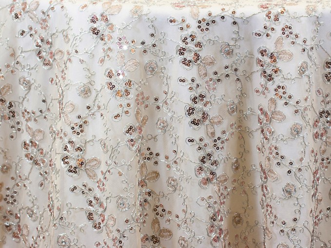 Sheer ivory, silver, and rose sequin floral print tablecloth.